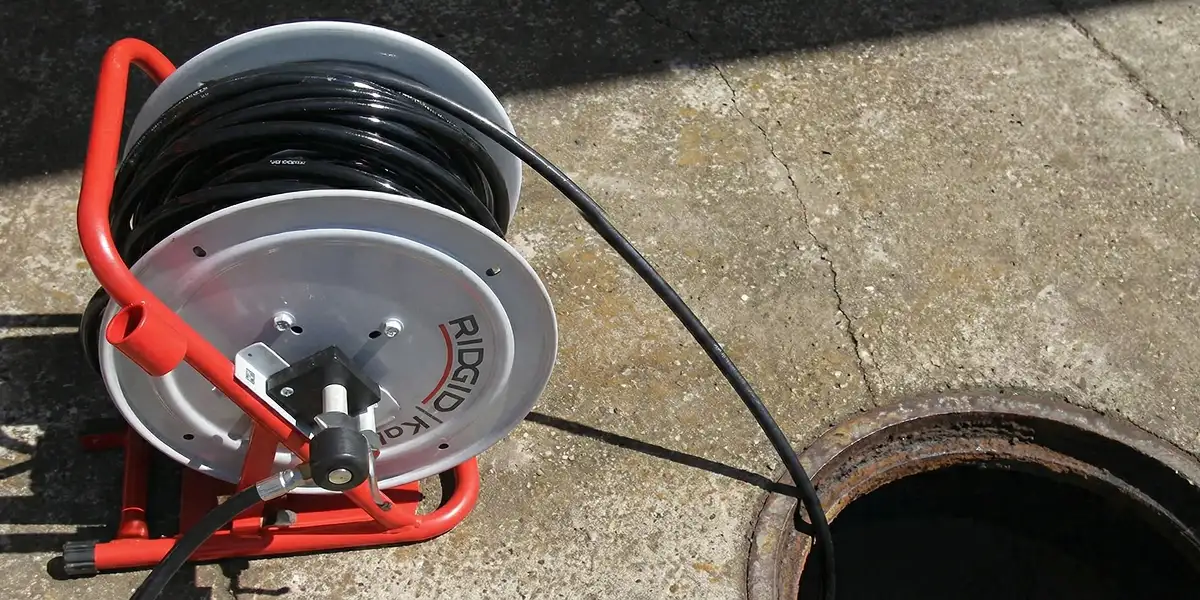 sewer rodding equipment prepared to clear clogged sewer lines in St Paul, MN