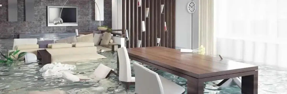 home interior affected by water damage with flooded floors and displaced furniture in St Paul, MN